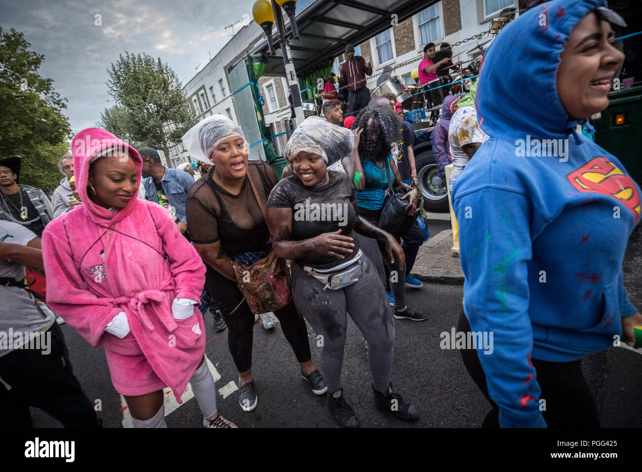 London, UK. 26th August 2018. Jouvert parade starts the Notting Hill Carnival 2018 festivities with the traditional ‘dirty’ paint, oil and coloured powder being thrown to the sounds of African drums and rhythm bands. Credit: Guy Corbishley / Alamy Live News Stock Photo