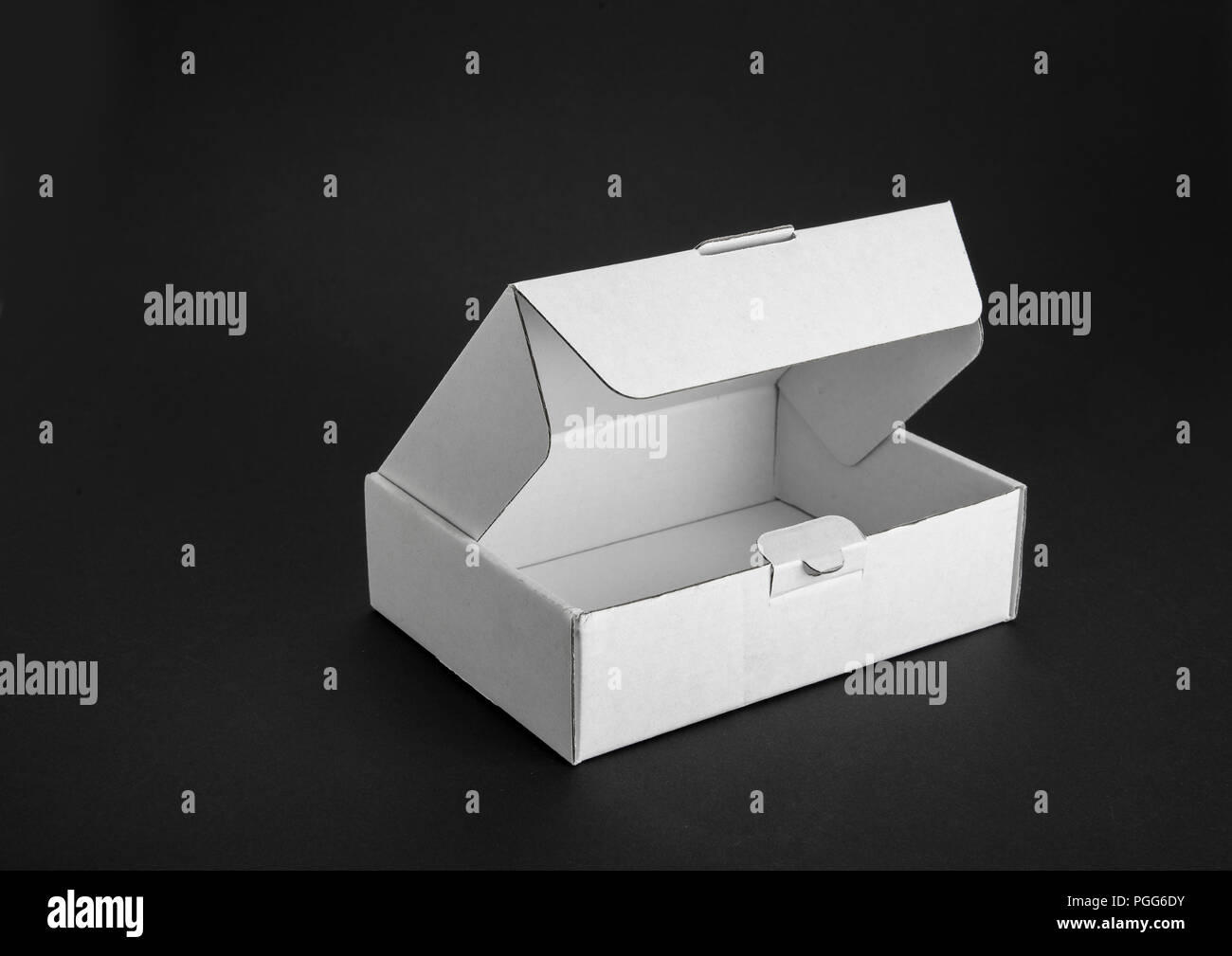 Cardboard paper box on a black background Stock Photo