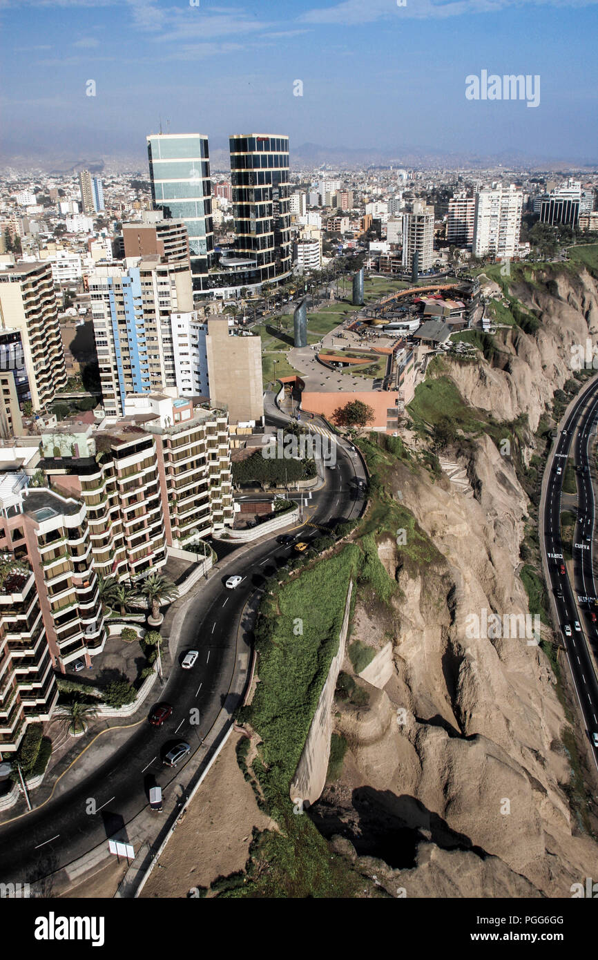 Aerial view over high rise apartments and coastal cliffs of Miraflores