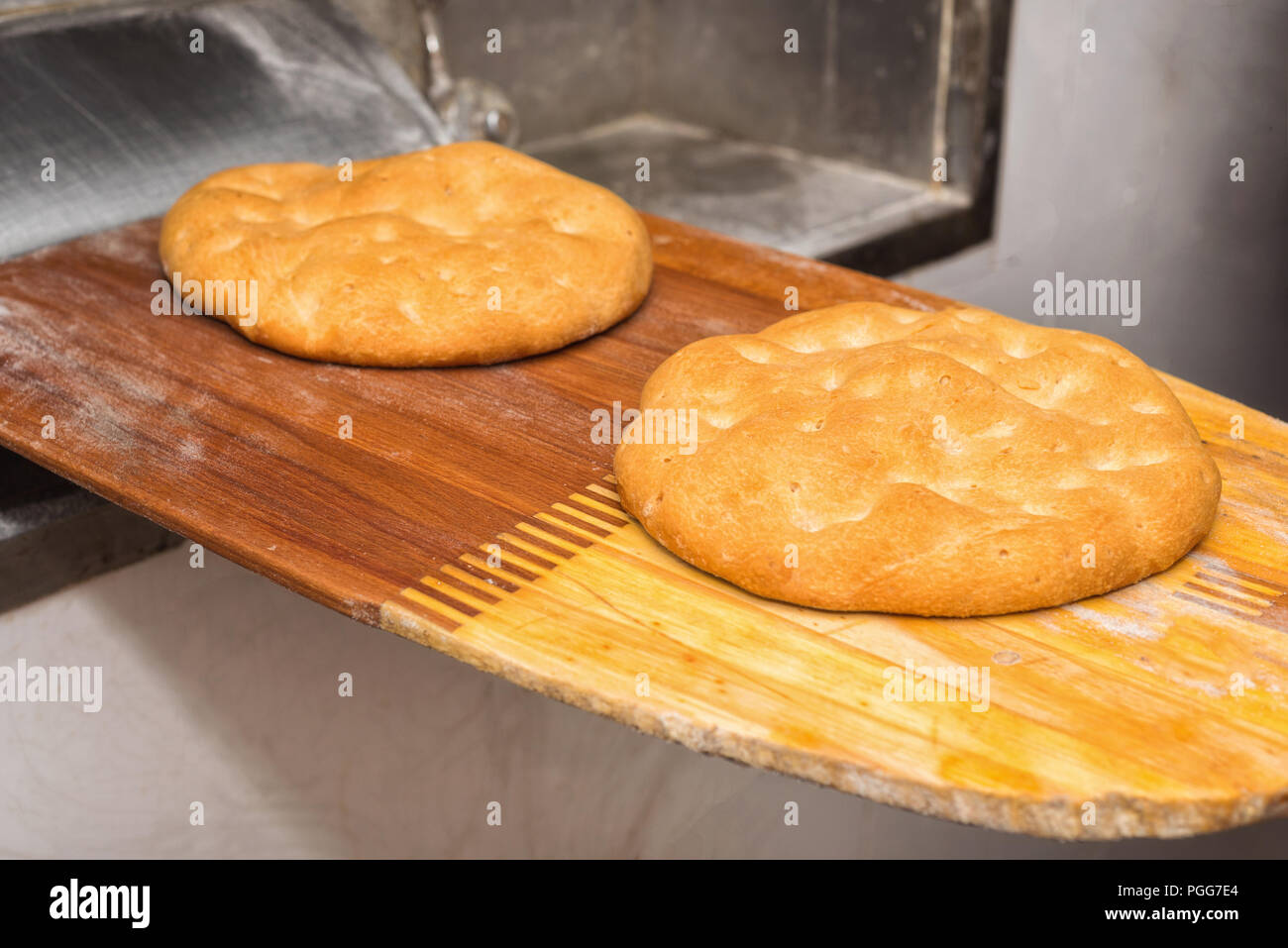 Pita bread freshly baked coming out of the oven Stock Photo