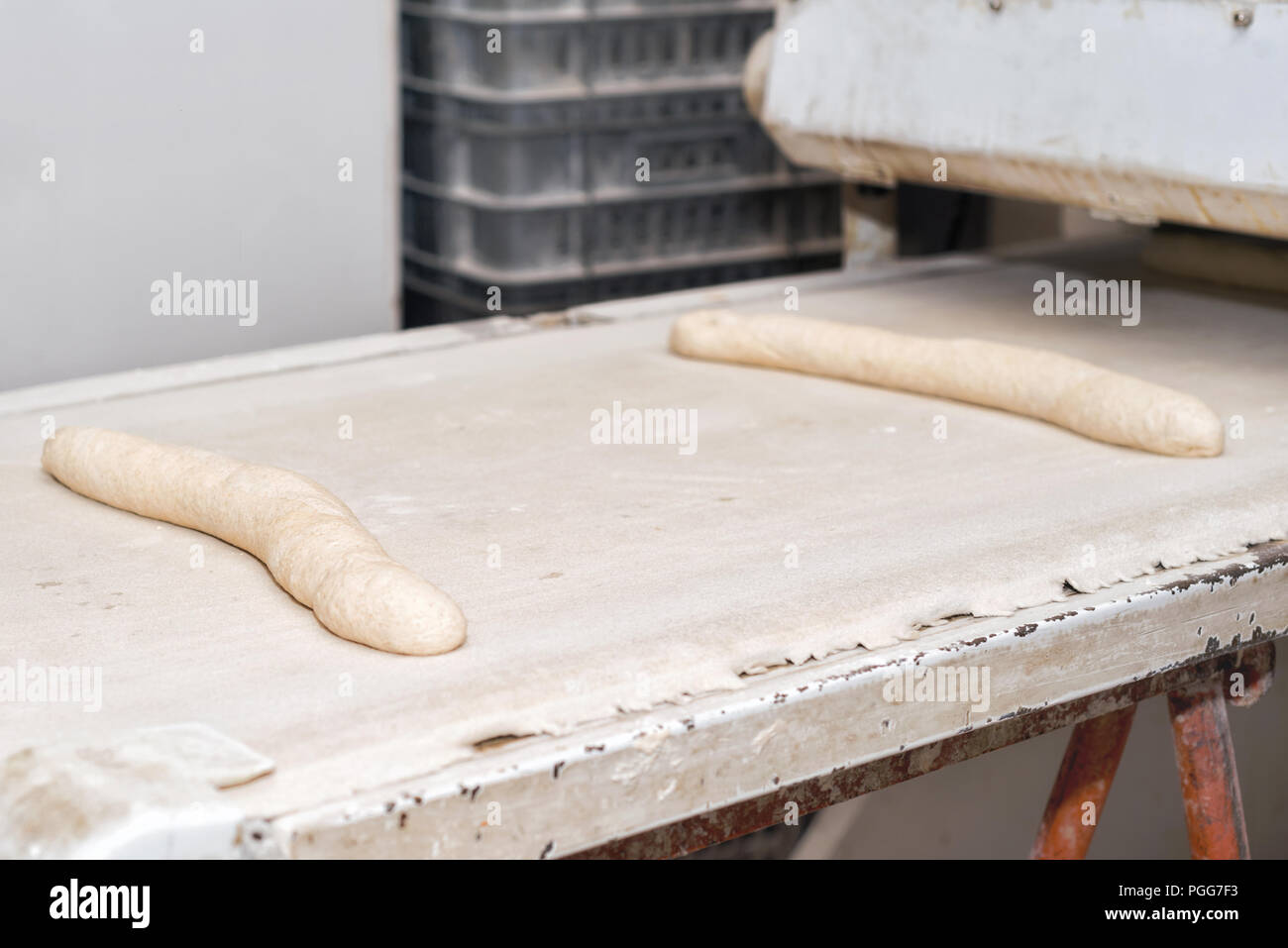 uncooked bread dough loaves ready to bake in industrial bakery Stock
