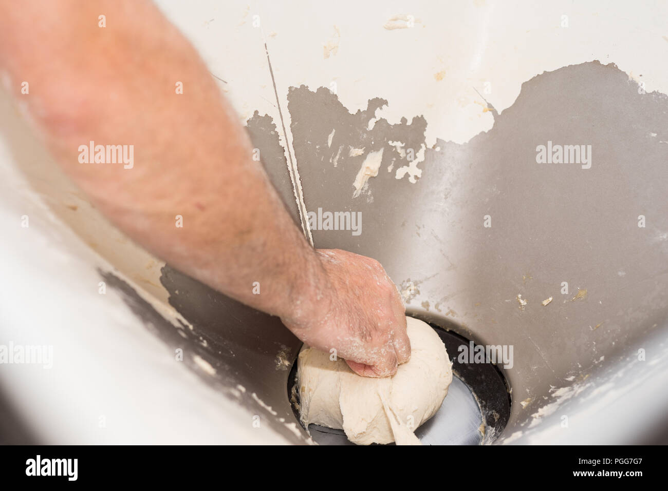 Baker hands kneading bread dough Stock Photo