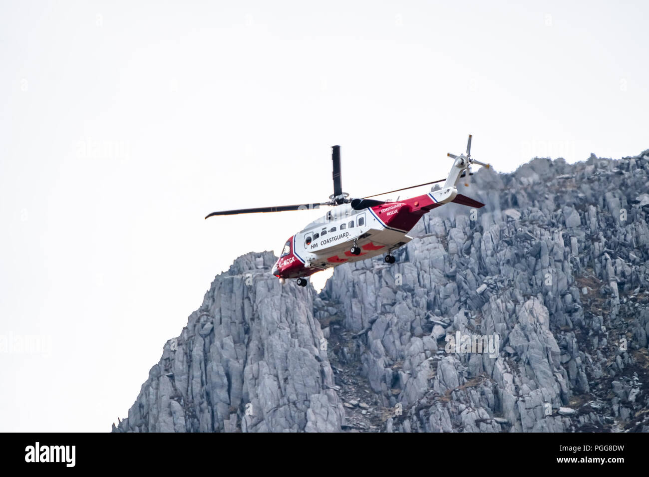 OGWEN GLEN / WALES - APRIL 29 2018 : British HM Coastguard helicopter Sikorsky S-92 operated by Bristow Helicopters conducting a rescue exercise at Og Stock Photo