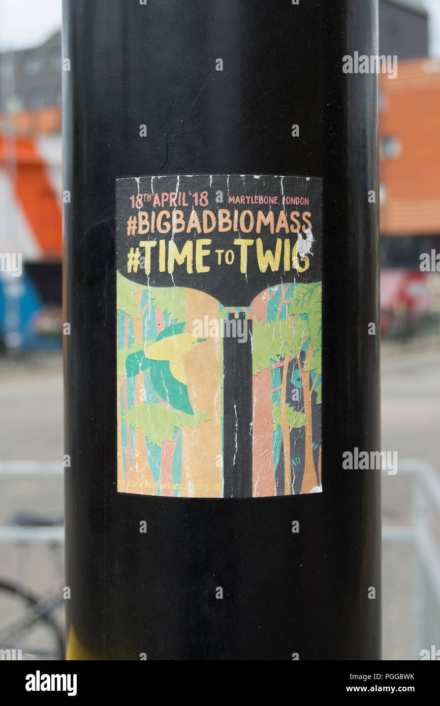 environmental campaign sticker on a lampost in walthamstow, london, england, drawing attention to a 2018 conference for the biomass industry Stock Photo