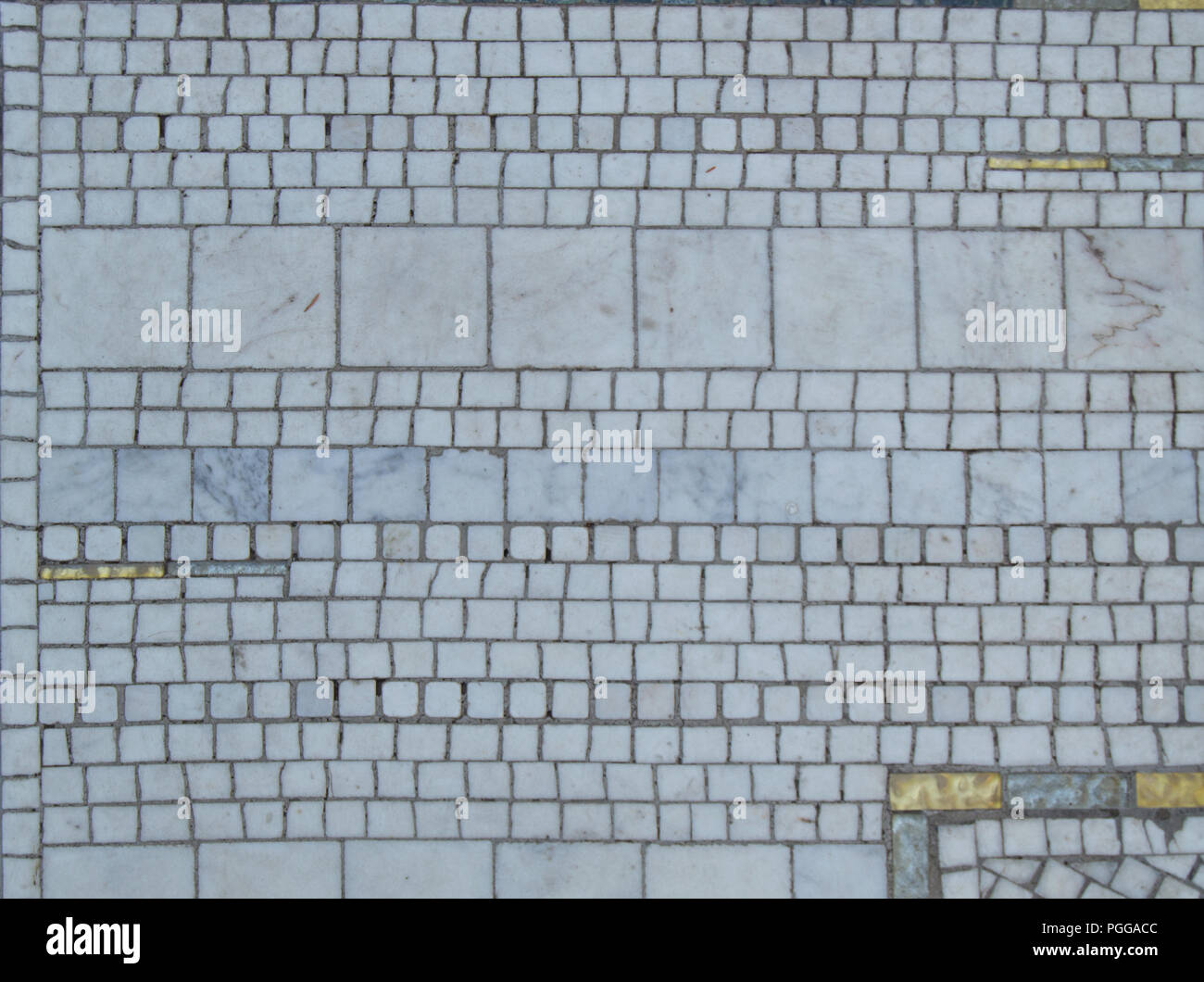 A Typical Mosaic On The Floor Of Ceramic Tiles Squares And