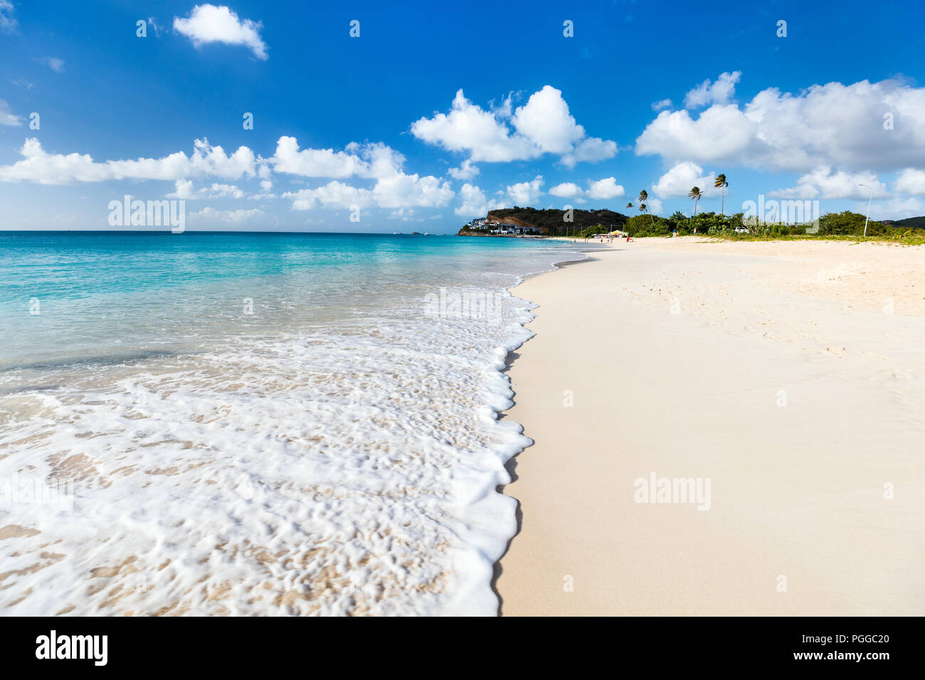 Idyllic tropical Darkwood beach at Antigua island in Caribbean with white sand, turquoise ocean water and blue sky Stock Photo