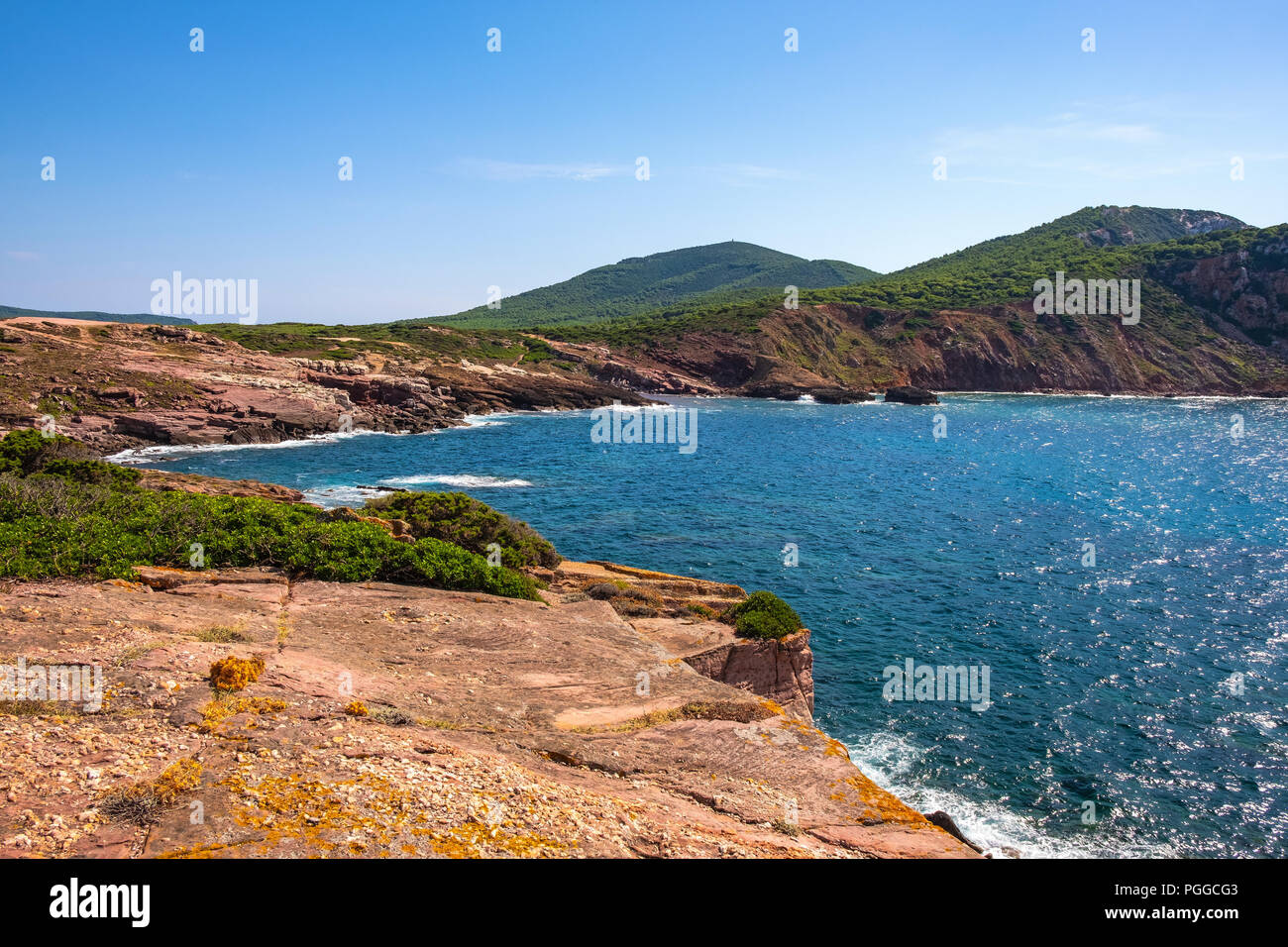 Alghero, Sardinia / Italy - 2018/08/11: Panoramic view of the Cala Porticciolo gulf with cliffs over the Cala Viola gulf in the Porto Conte Regional P Stock Photo
