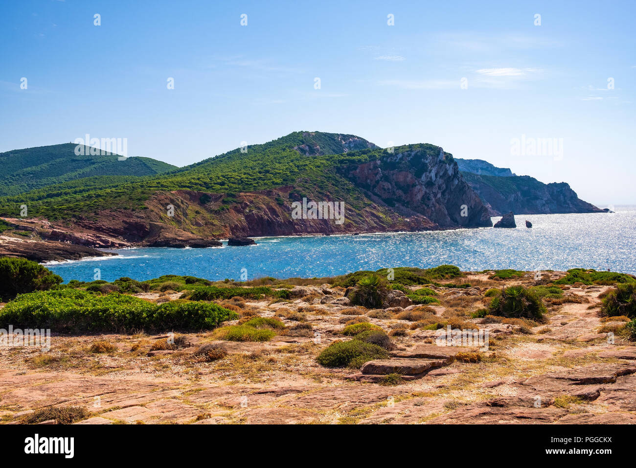 Alghero, Sardinia / Italy - 2018/08/11: Panoramic view of the Cala Porticciolo gulf with cliffs over the Cala Viola gulf in the Porto Conte Regional P Stock Photo