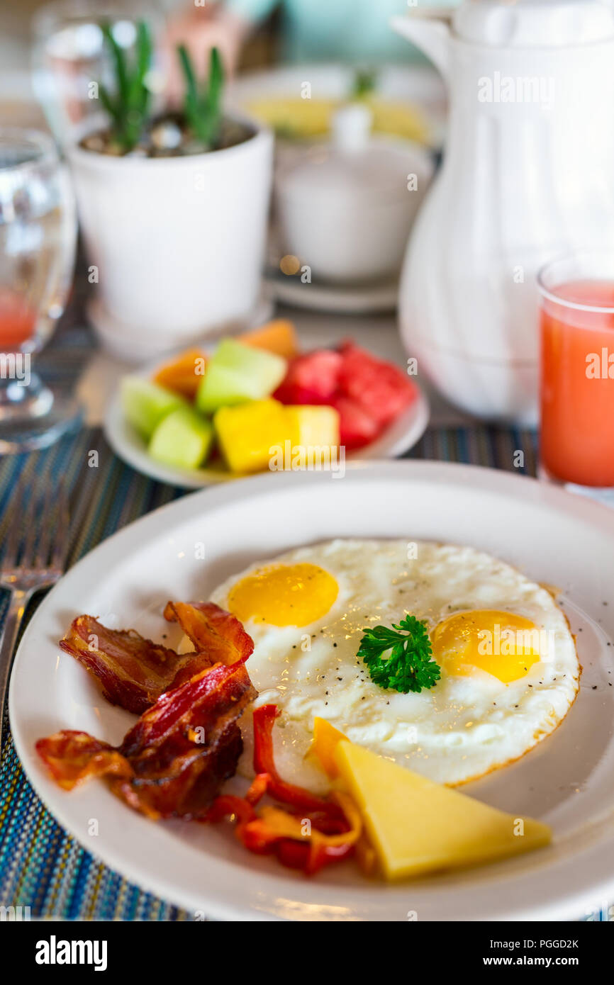 Delicious breakfast with fried eggs and bacon Stock Photo - Alamy