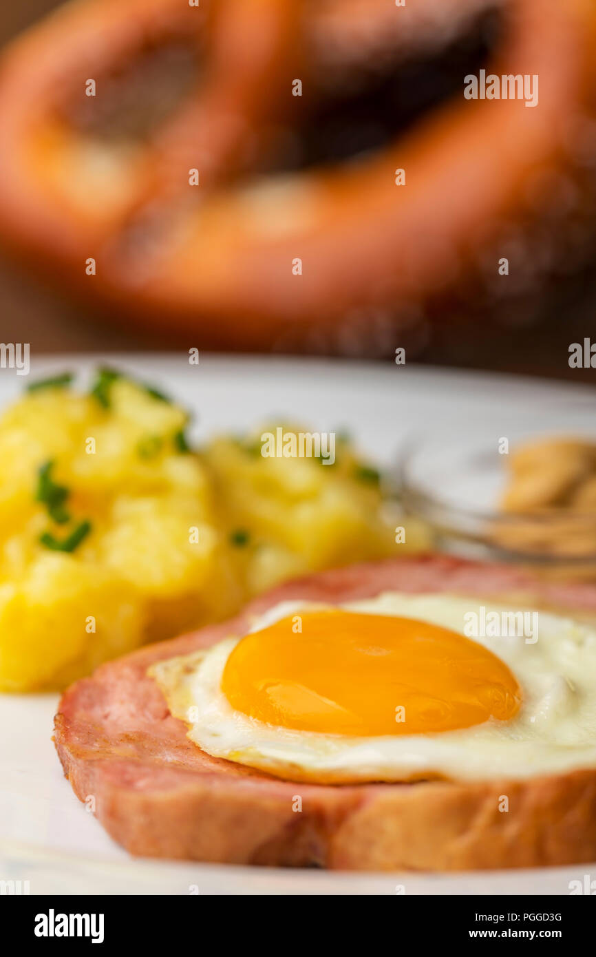 A Typical Bavarian Snack The Leberkaese With Potato Salad Stock Photo a-typical-bavarian-snack-the-leberkaese-with-potato-salad-stock-photo