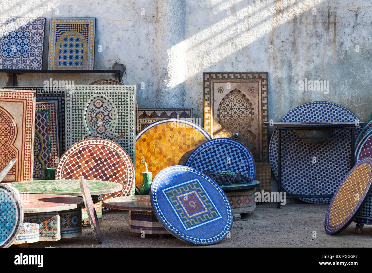 Morocco Fez, many mosaic tiled table tops and wall fountains at a local fabricator. Beautiful classic patters and colors. Copy space. Stock Photo