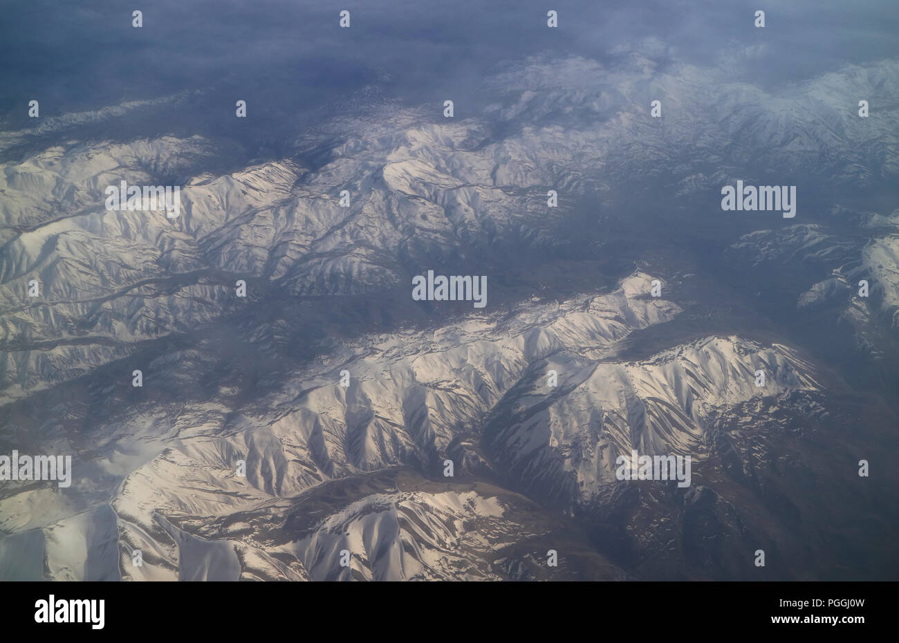 Stunning aerial view of snow capped mountain ranges Stock Photo - Alamy
