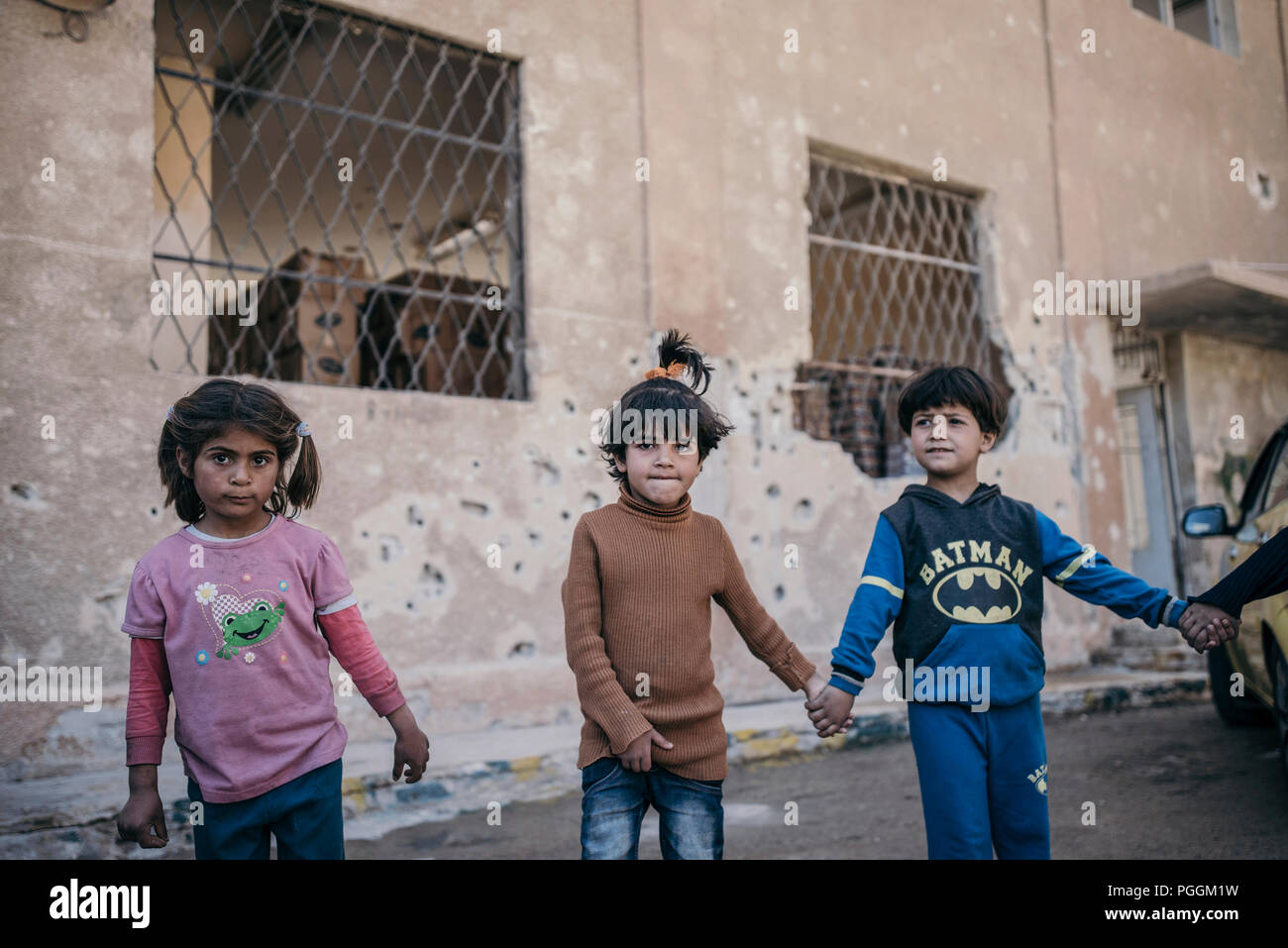Group of displaced children from ' kafr batna-Eastghouta-Damascus' it shows three girls in a social activity with 'NRC-The Norwegian Refugee Council' Stock Photo