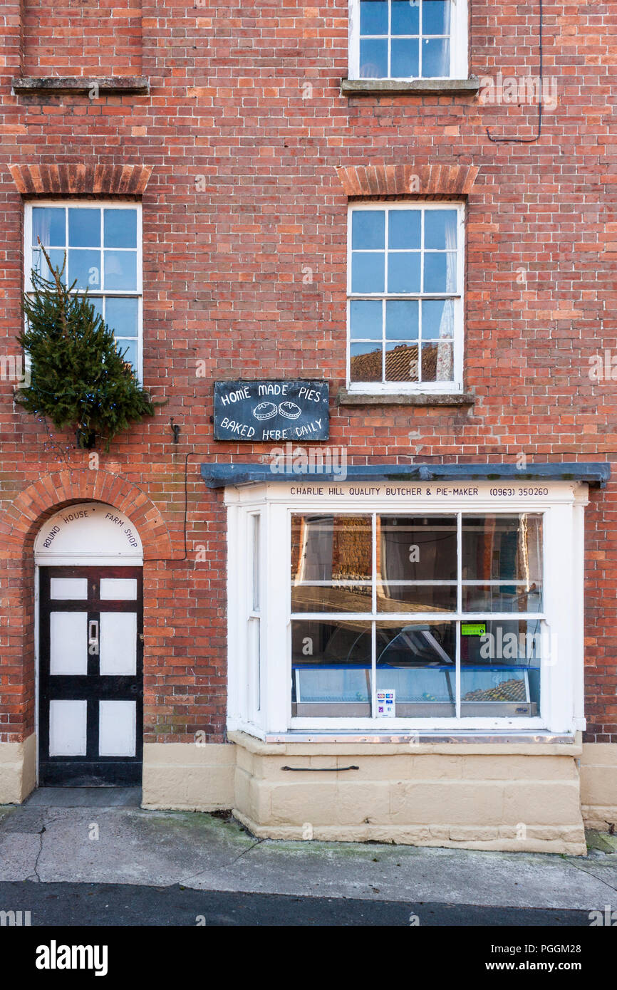 Village butcher's shop store front in country village of Castle Cary, Somerset, England, GB, UK. Stock Photo