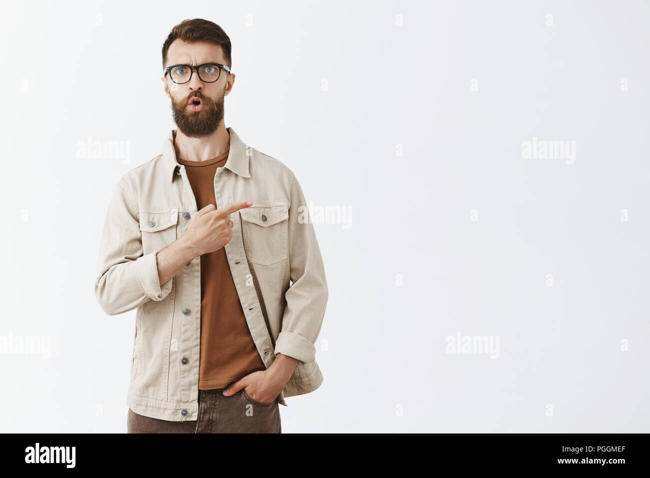 Intense Shocked Hipset Guy With Long Brown Beard And Short