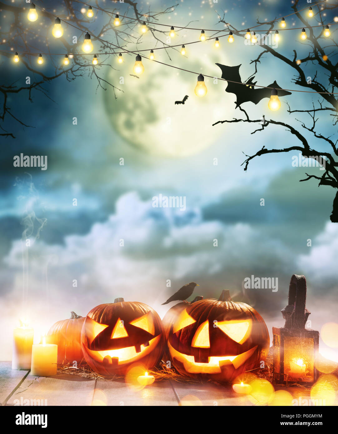 Spooky halloween pumpkins on wooden planks with dark horror background ...