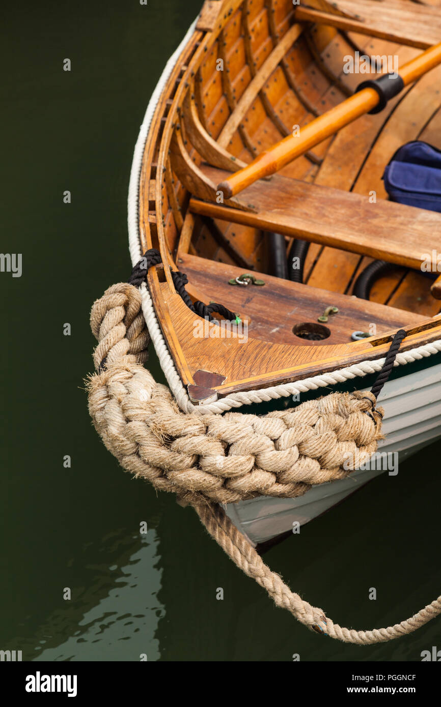 Decorative rope protection on the bow of a wooden dinhy Stock Photo