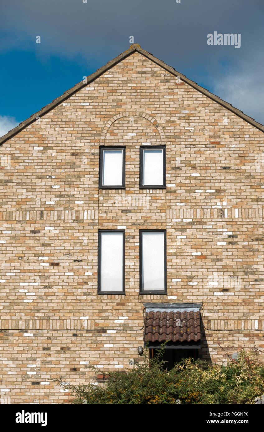 window brickwork design end wall of housing Stock Photo