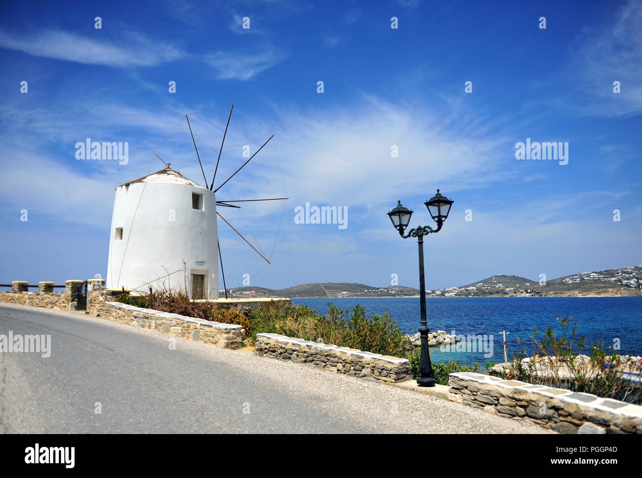 Old traditional greek windmill in the street of Parikia, Paros island ...