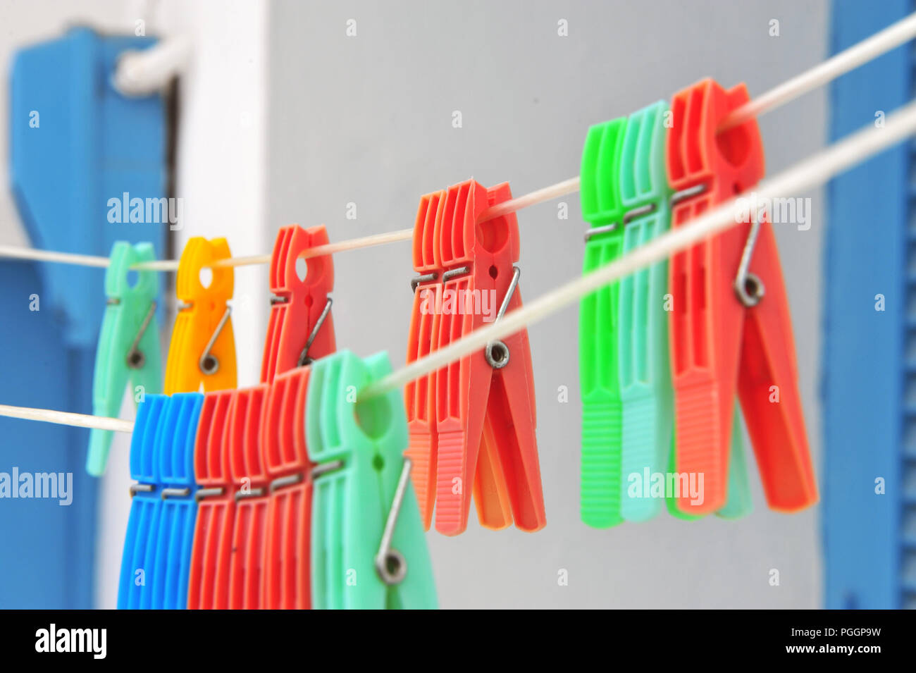 Hanging colorful clothes pegs in the street Stock Photo
