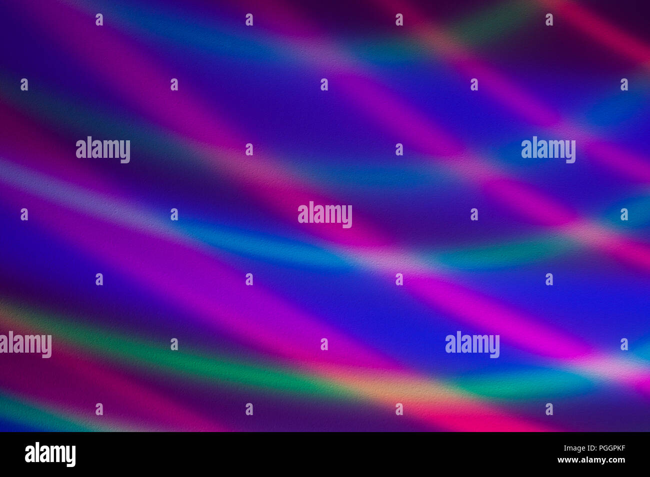 Disco lights with multicolored light streaks of repeating colors and ...