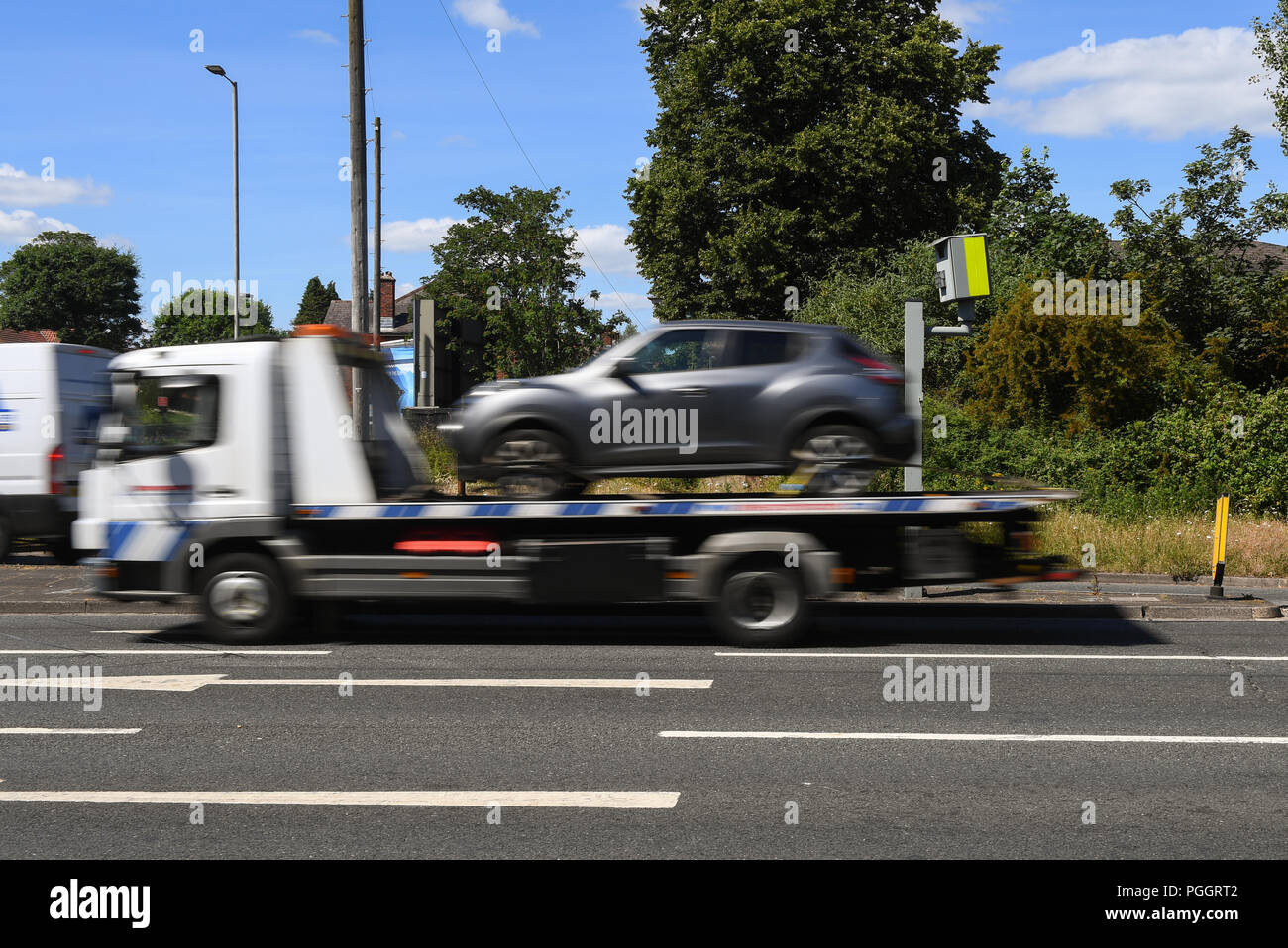 A red light traffic offence camera with cars blurring by Stock Photo