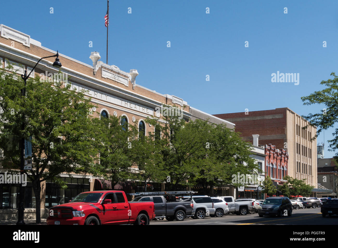 Brick Buildings and Traffic , Central Avenue, Great Falls, MT, USA Stock Photo
