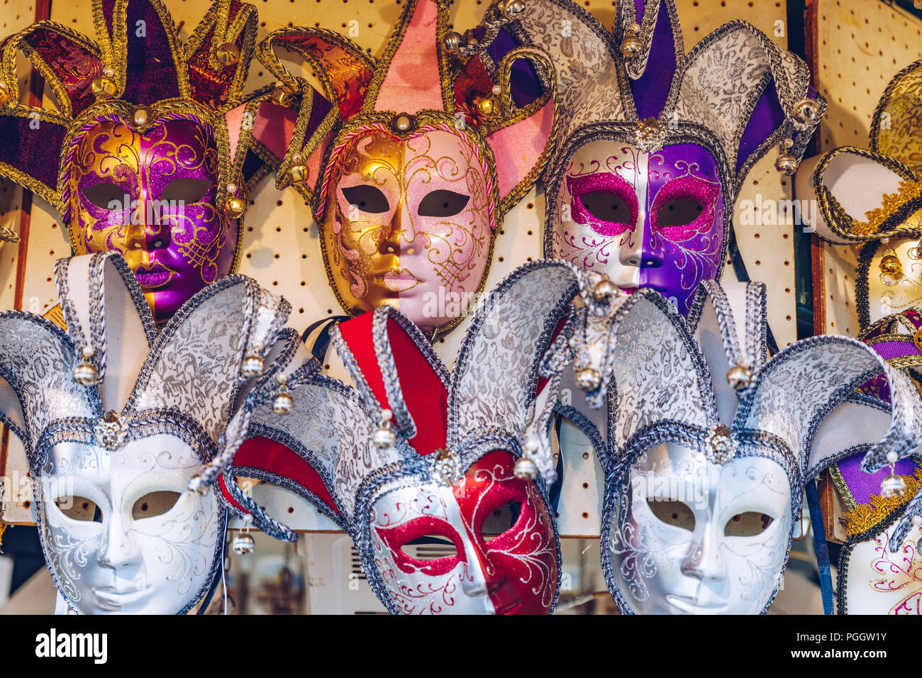 Group of Vintage venetian carnival masks. Venetian masks in store display in Venice. Annual carnival in Venice is among the most famous in Europe. Its Stock Photo