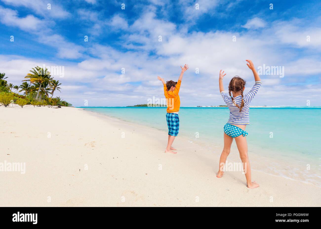 Kids having fun at tropical beach during summer vacation Stock Photo