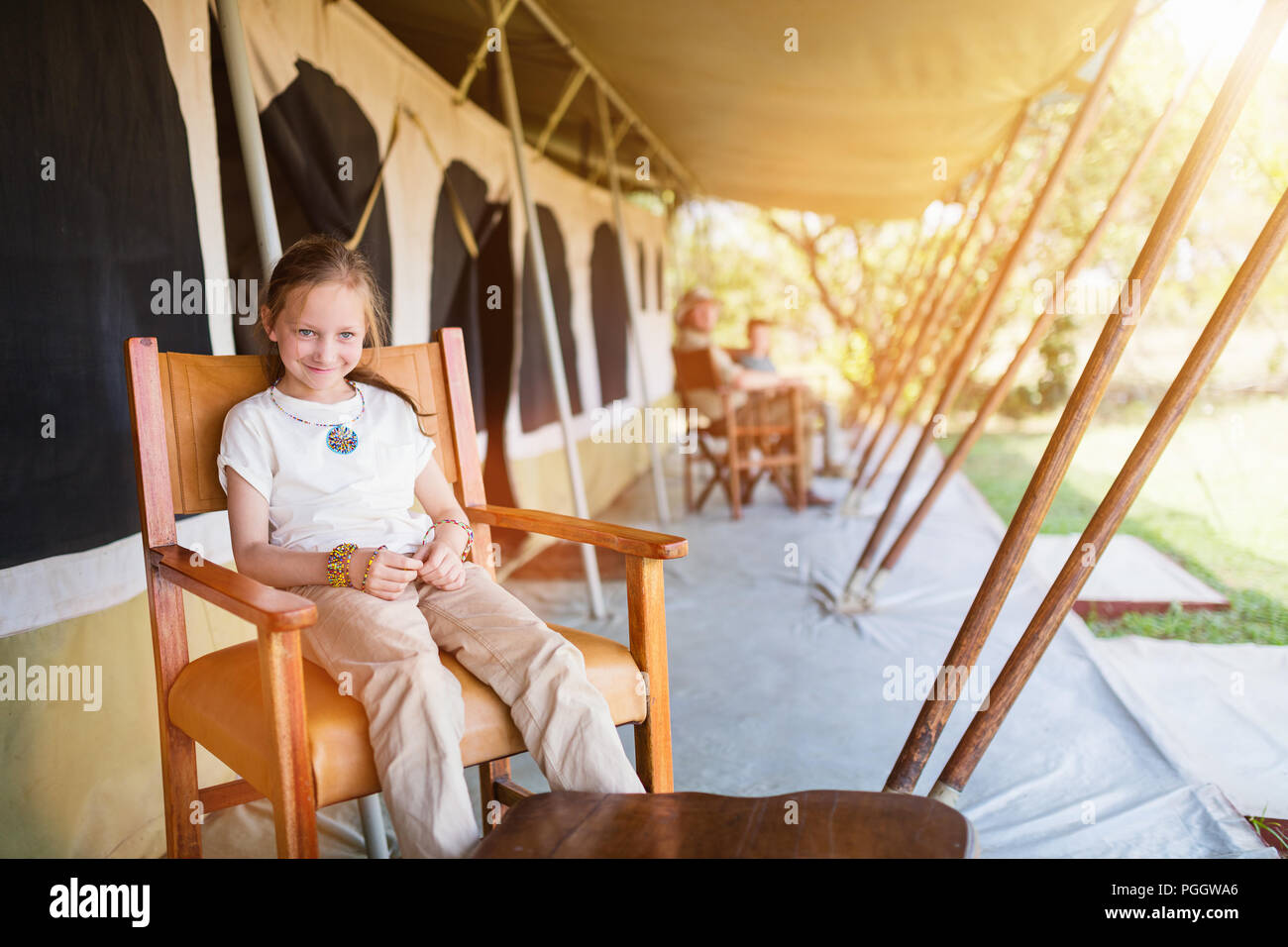 Family in safari tent enjoying vacation in Africa Stock Photo