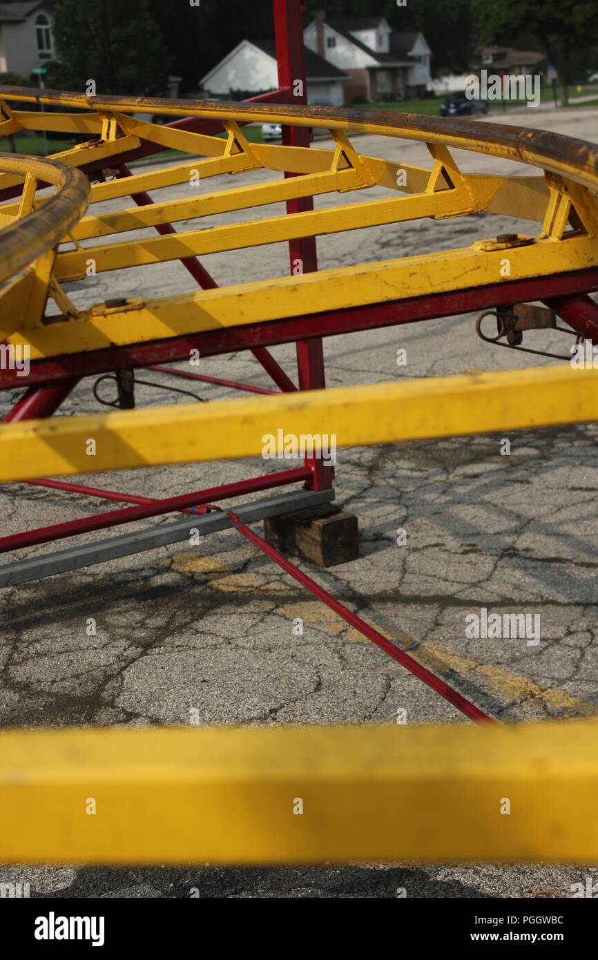 Traveling kiddie carnival ride roller coaster rail tracks under