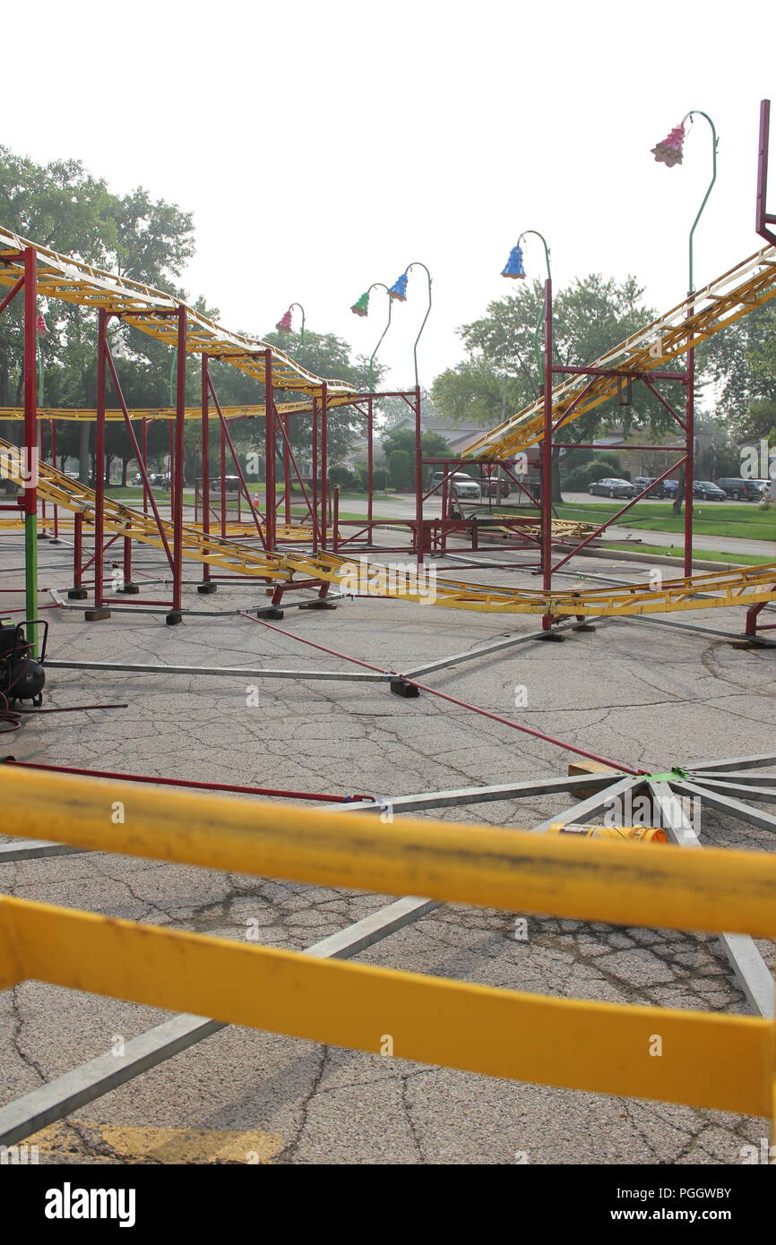 Traveling kiddie carnival ride roller coaster rail tracks under