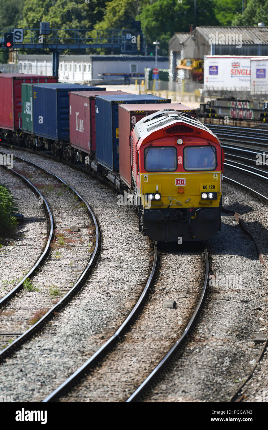 Container railway train travelling on the main line into Southampton ...