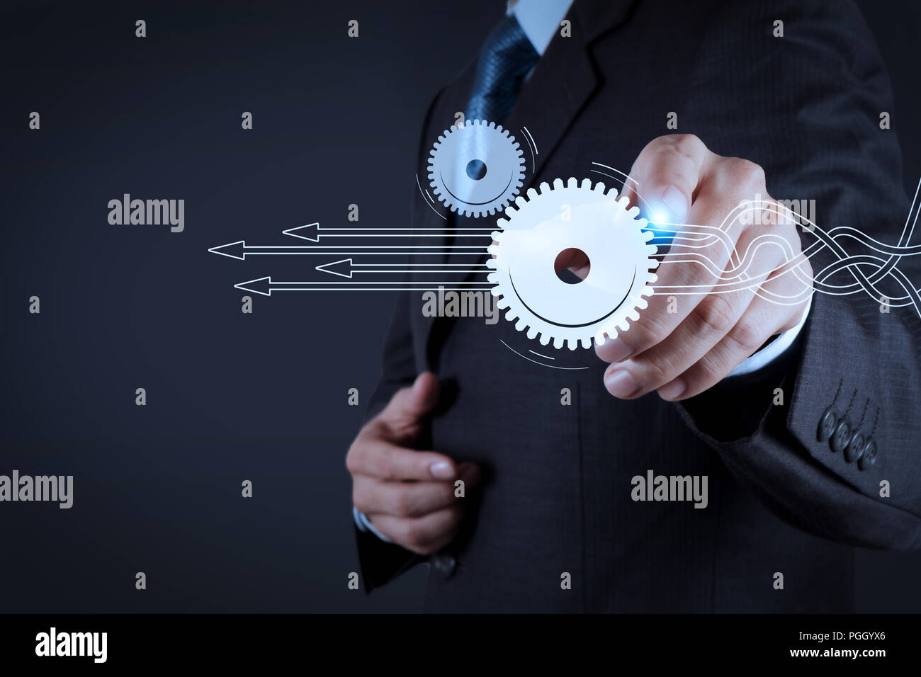 Thinking about structuring virtual diagram of business process with solutions. Businessman hand pressing an imaginary button on virtual screen Stock Photo