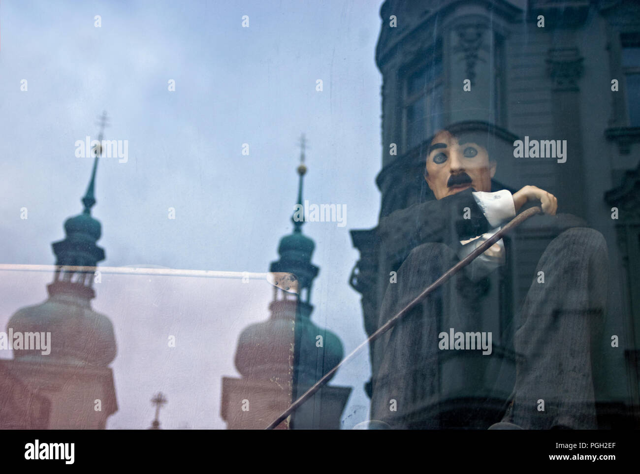 Figure of Charlie Chaplin in a window in Prague. Stock Photo