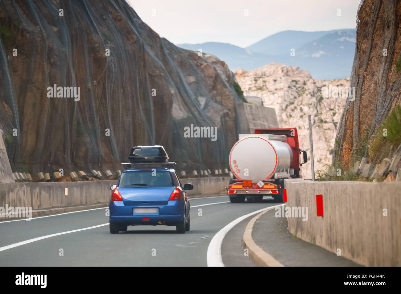 Rear view of car and tank truck driving over Krk brige in Croatia Stock Photo Alamy