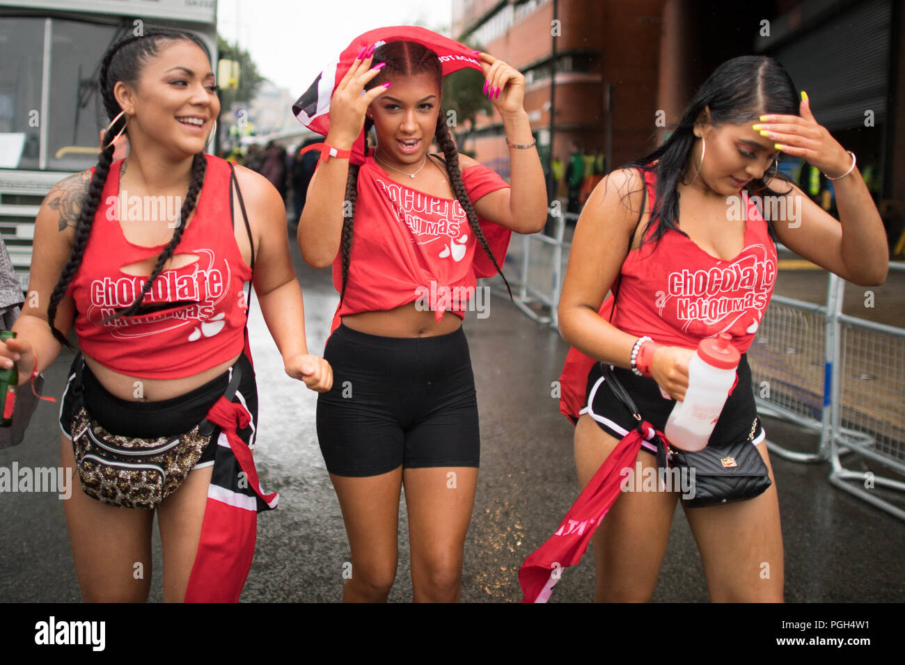Participants in this year's Notting Hill Carnival brave heavy rain during Family Day. Stock Photo