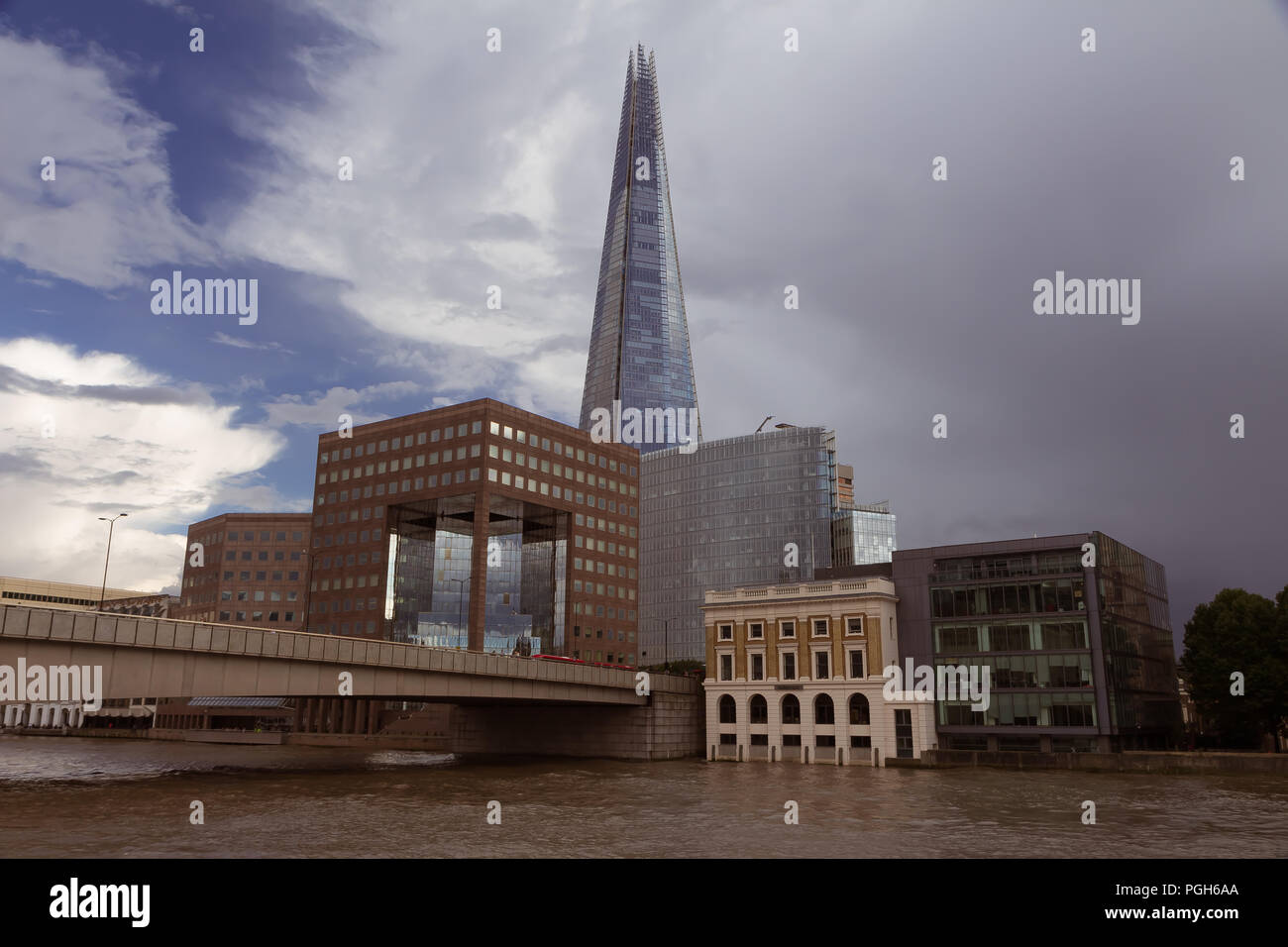 September 2017 - river view of the Shard skyscraper in London, UK, surrounded by modern cubic buildings Stock Photo