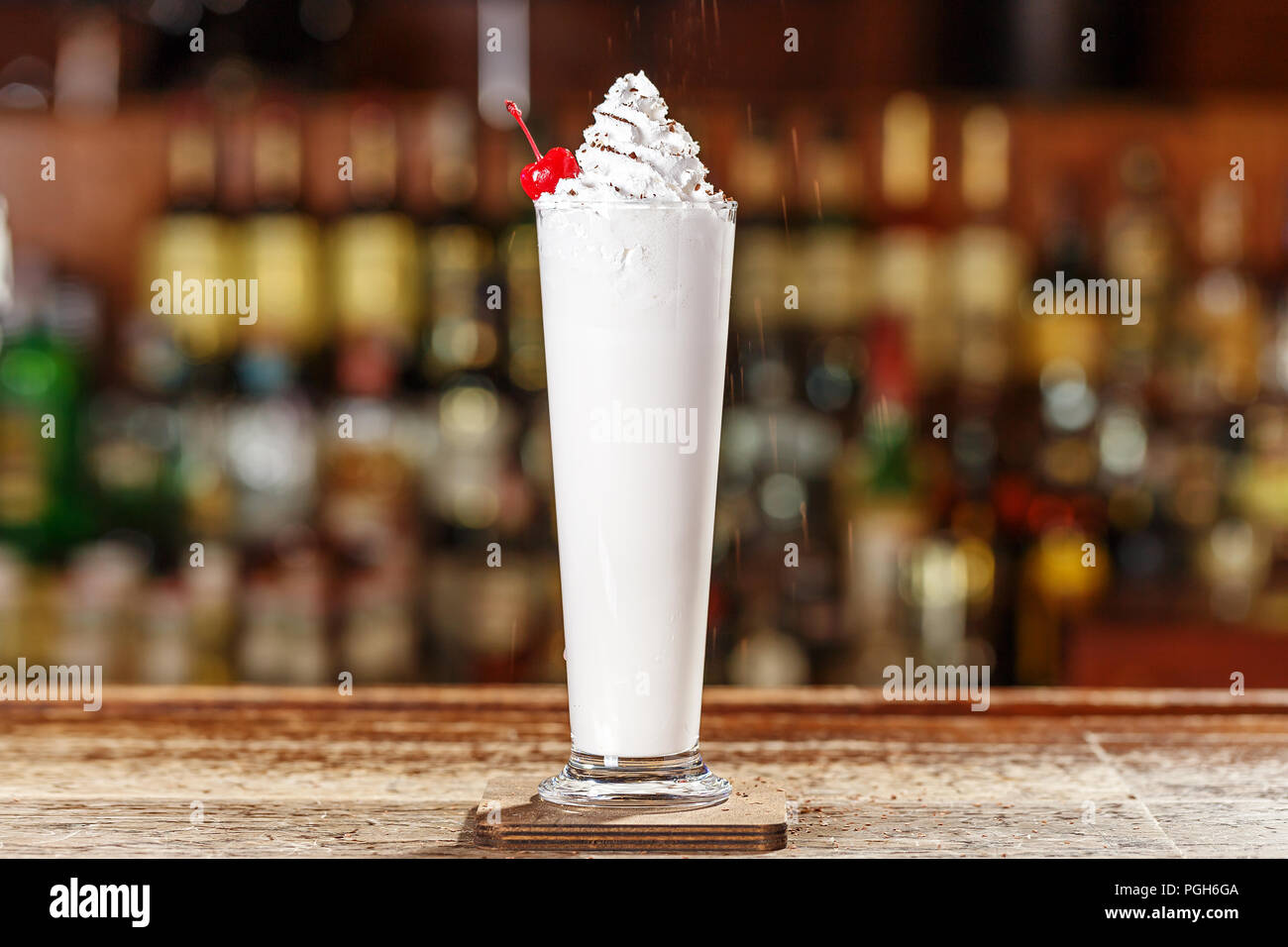 Liquor, ice cream and cream in a blender with half a cup of crushed ice
