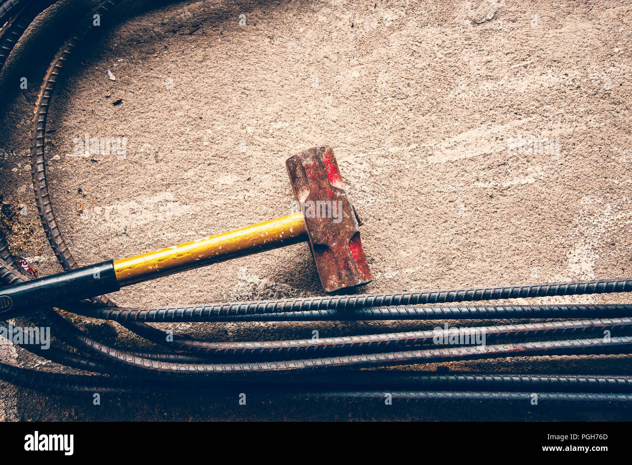 rust hammer steel bar, big hamer on steel bar and congreat Stock Photo