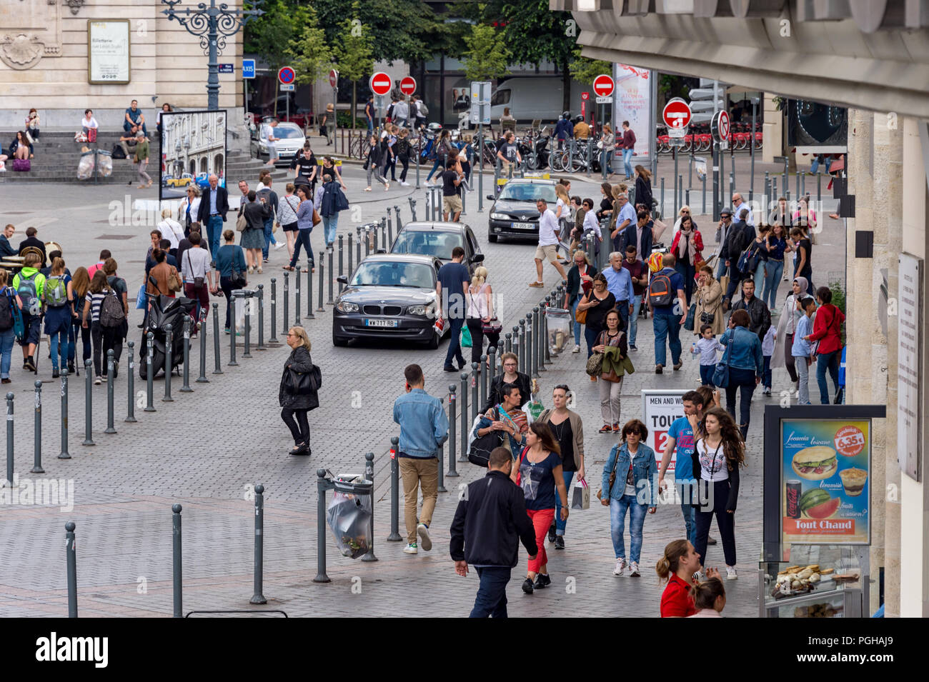 Lille, France - 15 June 2018: pedestrians walking on Rue des Manneliers street. Stock Photo