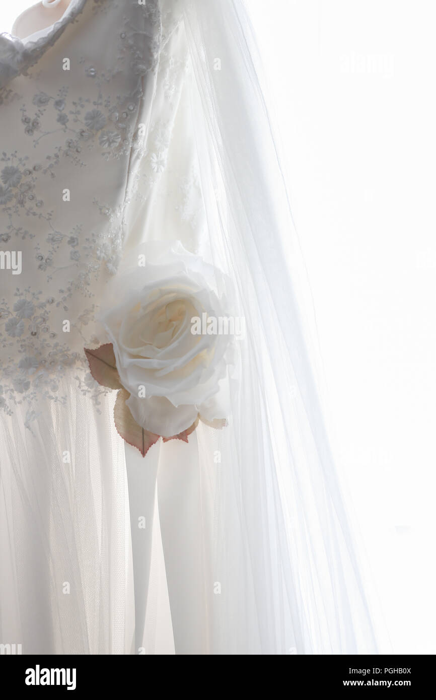 ivory fabric rose embellishment on wedding dress Stock Photo