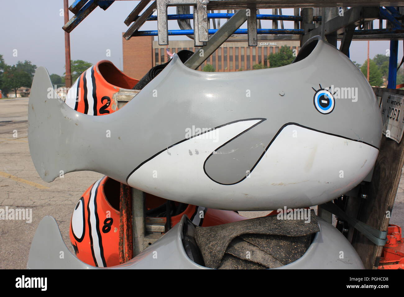 Traveling kiddie carnival spinning fish ride under construction in a ...