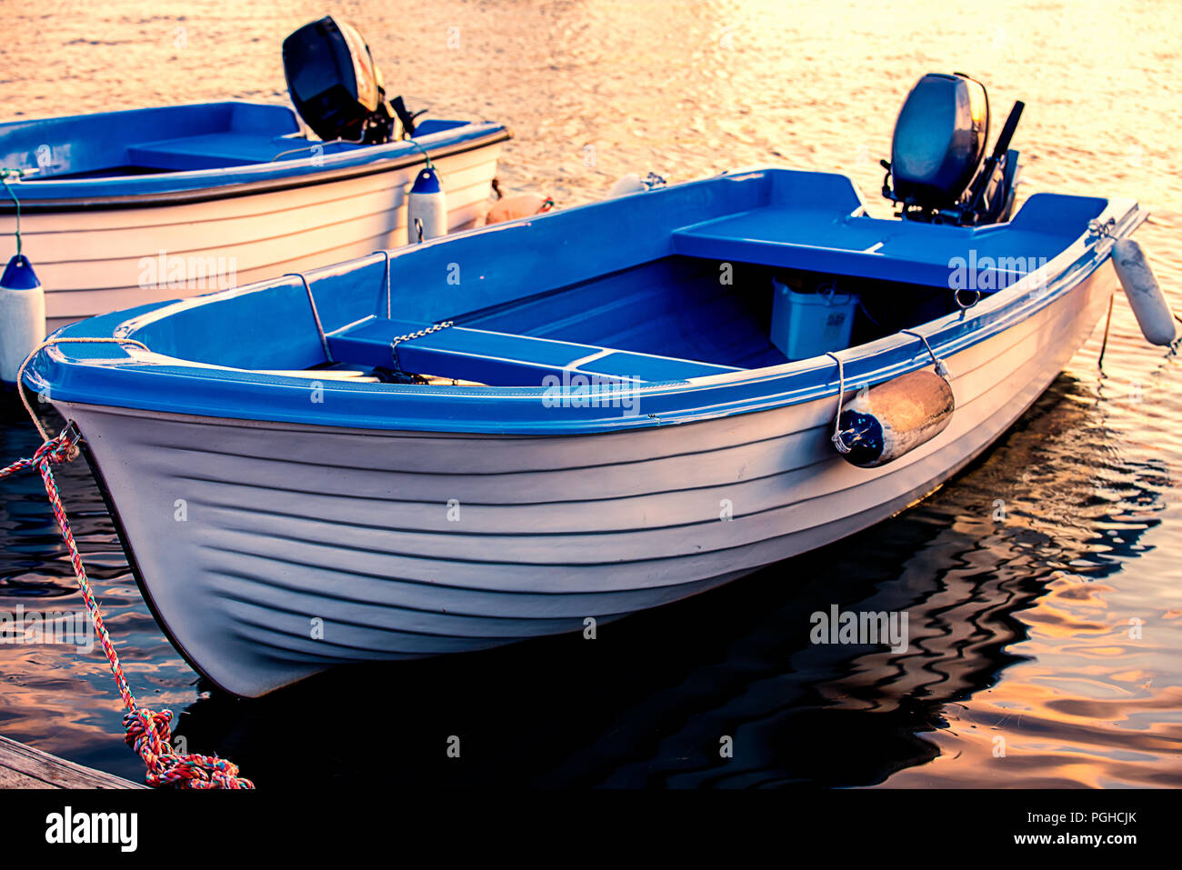 Reflection of boats in the water Stock Photo - Alamy