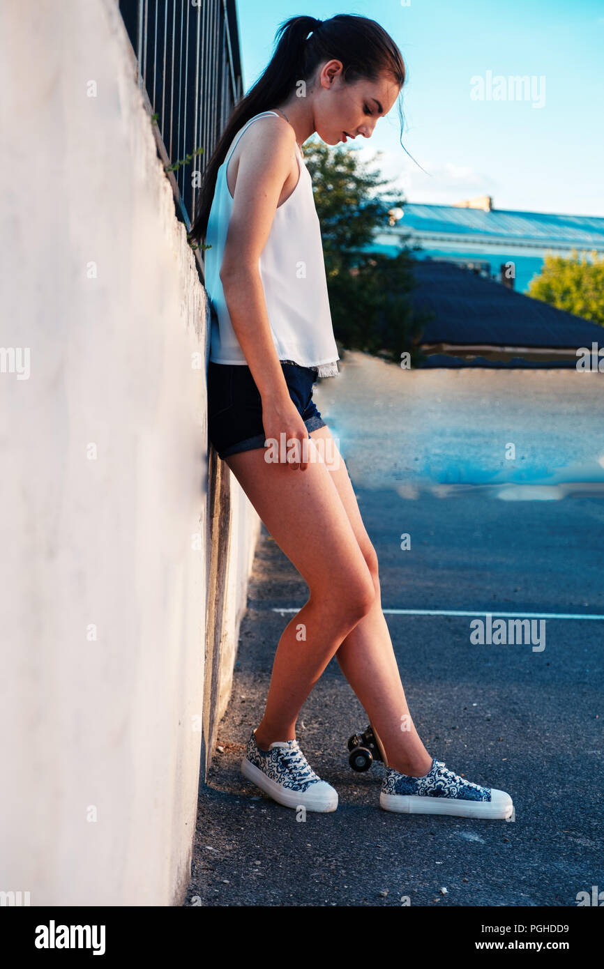 Full Body Shot Of Skater Girl In Short Shorts Leaning Back Used