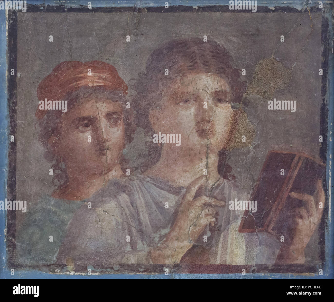 Portrait of two women with wax tablets and stylus depicted in the Roman fresco from Herculaneum (1-79 AD), now on display in the National Archaeological Museum (Museo Archeologico Nazionale di Napoli) in Naples, Campania, Italy. Stock Photo