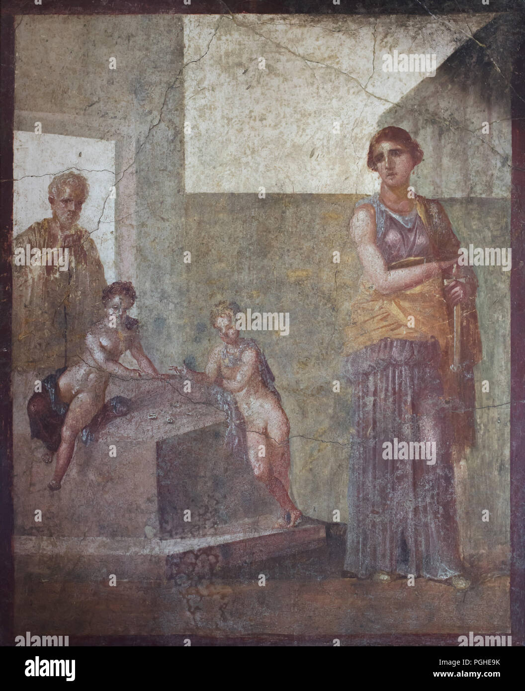 Medea planning the murder of her children depicted in the Roman fresco from the House of the Dioscuri (Casa dei Dioscuri) in Pompeii (62-79 AD), now on display in the National Archaeological Museum (Museo Archeologico Nazionale di Napoli) in Naples, Campania, Italy. In their ignorance they play knucklebones, while an elderly teacher helps them. The fresco is thought to derive from a work by Timomachos of Byzantium, who was active around the middle of the 1st century BC. Stock Photo