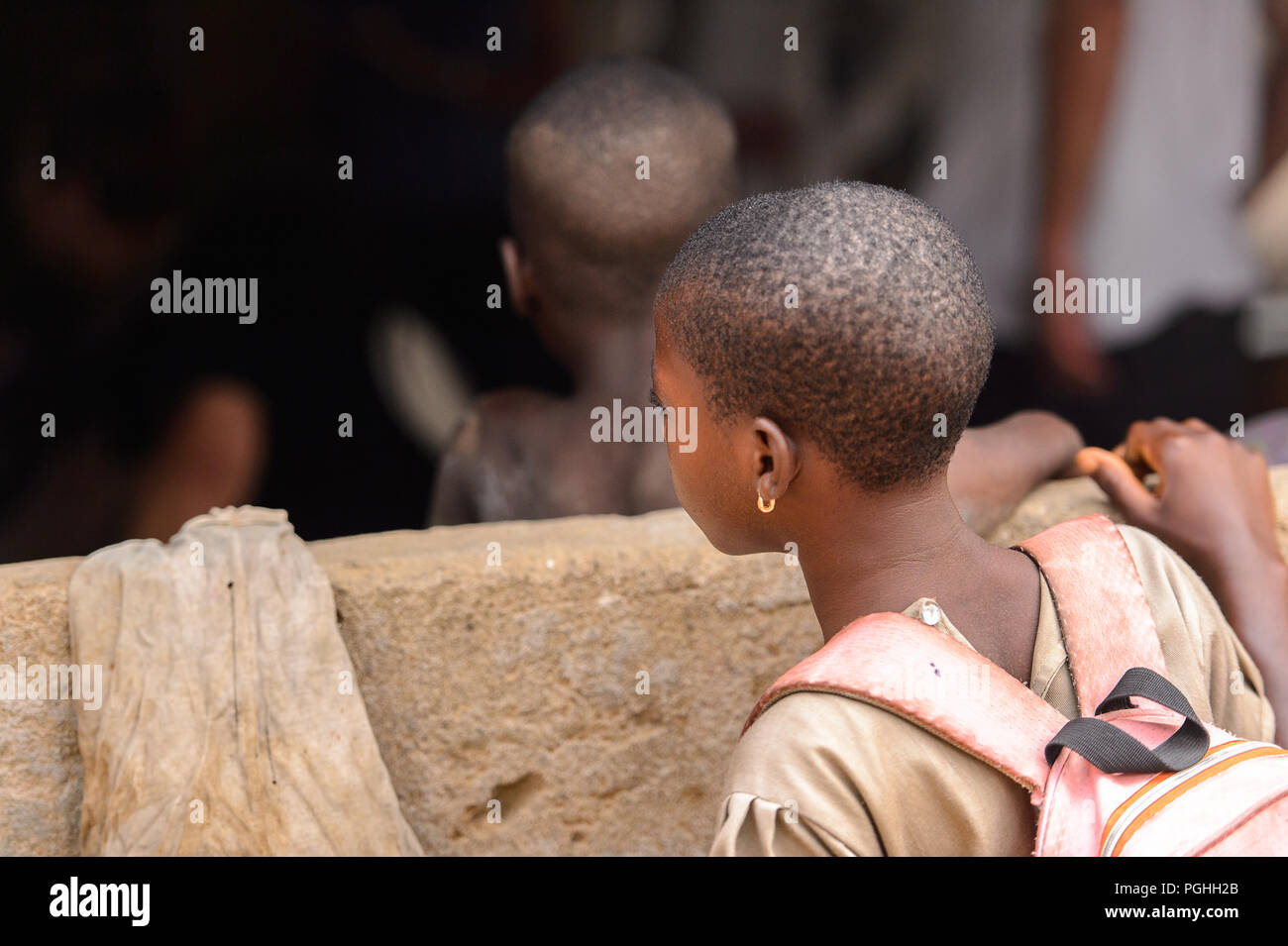 LOME, TOGO Jan 9, 2017 Unidentified Togolese young girl carries a
