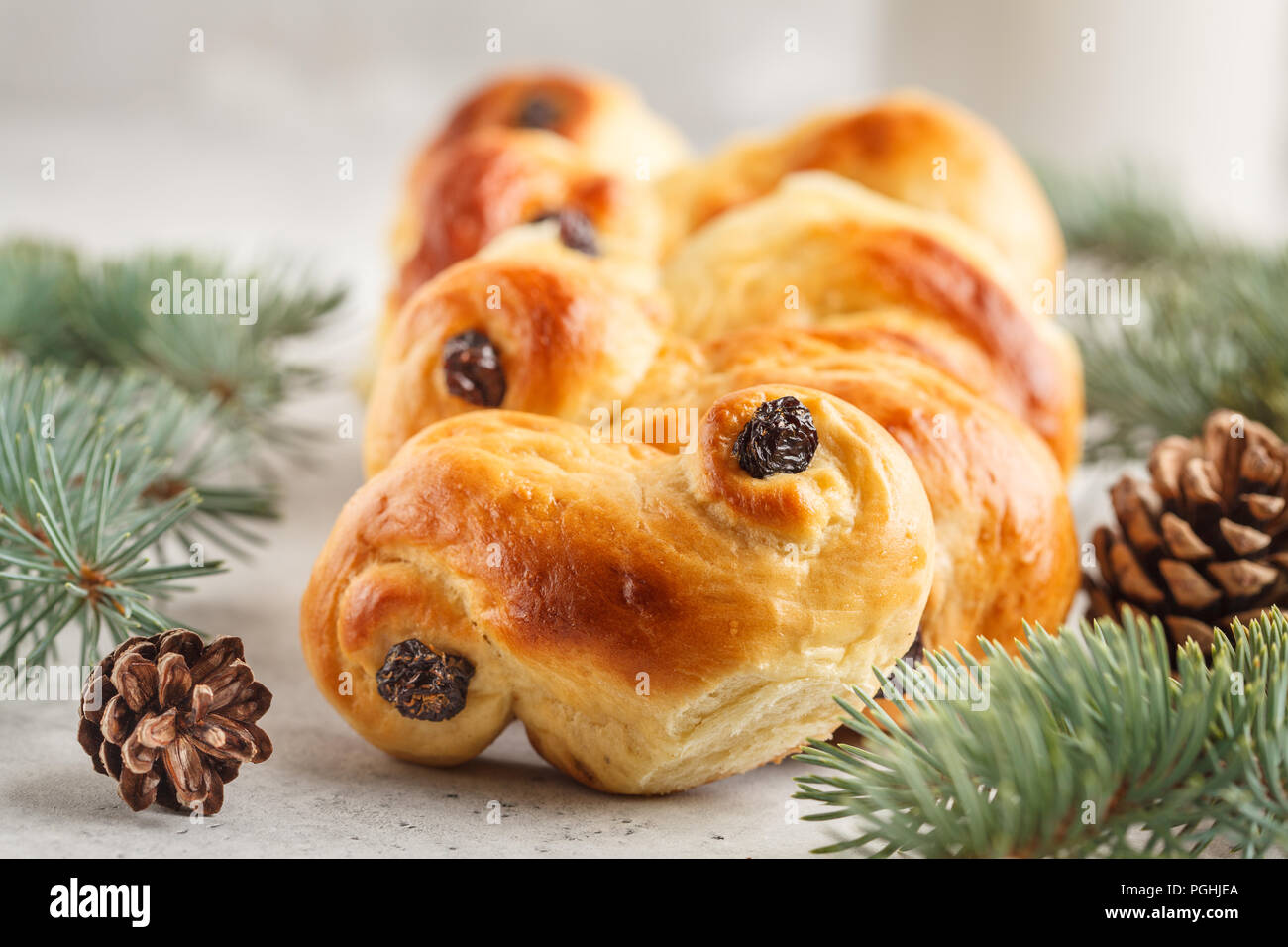 Traditional Swedish Christmas saffron buns (lussebulle or lussekatt). Swedish christmas. White background, Christmas decoration. Stock Photo