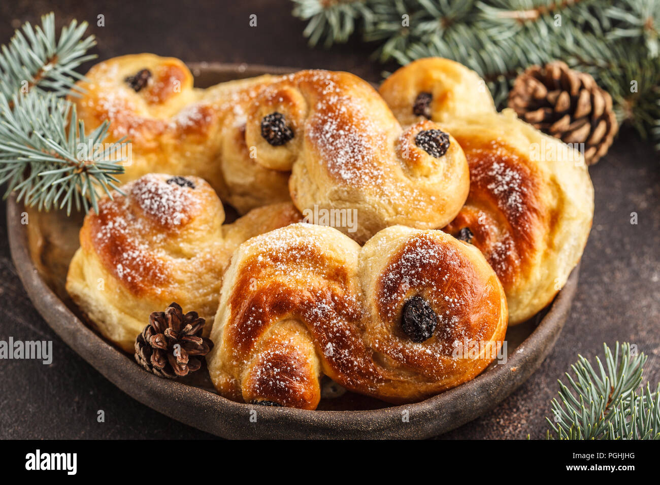 Traditional Swedish Christmas saffron buns (lussebulle or lussekatt). Swedish christmas. Dark